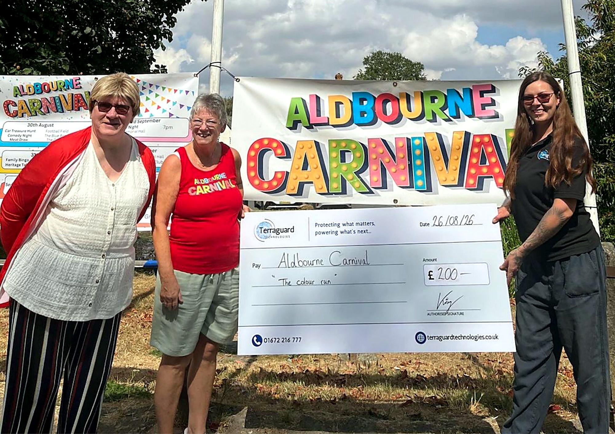 Terraguard presenting a donation cheque to Aldbourne Carnival